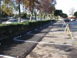 Saw-cut Remove Replace & Installed Rubber Stops Asphalt Long Beach CA